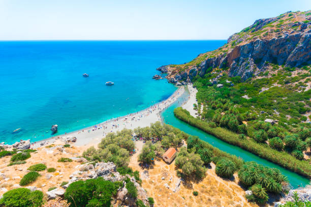 Preveli Beach View of Preveli beach at Libyan sea, river and palm forest, southern Crete , Greece
