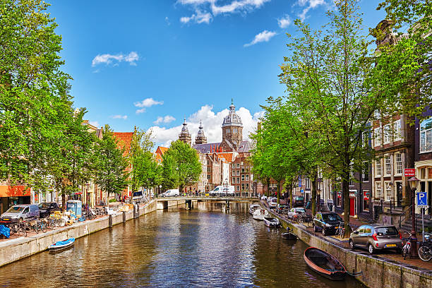 Amsterdam, Netherlands- September 15, 2015: Westerkerk (Western Church), with water canal view in Amsterdam. Netherlands.