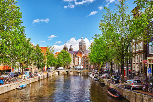 The Jordaan Amsterdam, Netherlands- September 15, 2015: Westerkerk (Western Church), with water canal view in Amsterdam. Netherlands.