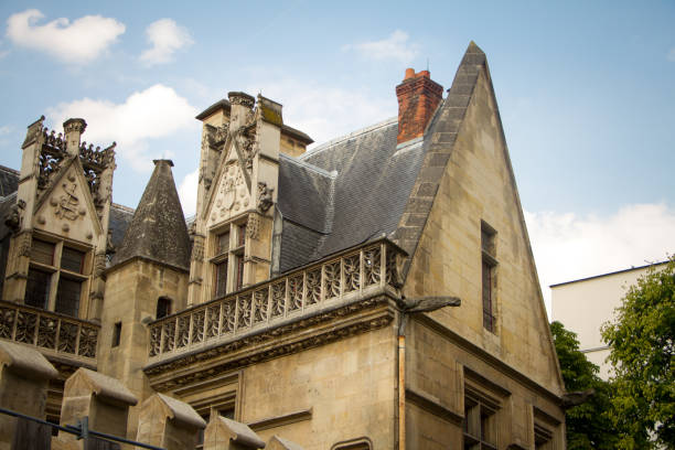 Paris, France - July 7, 2018: Architectural details and emblems of faculties on the roof of the Musee de Cluny a landmark national museum of medieval arts and Middle Ages